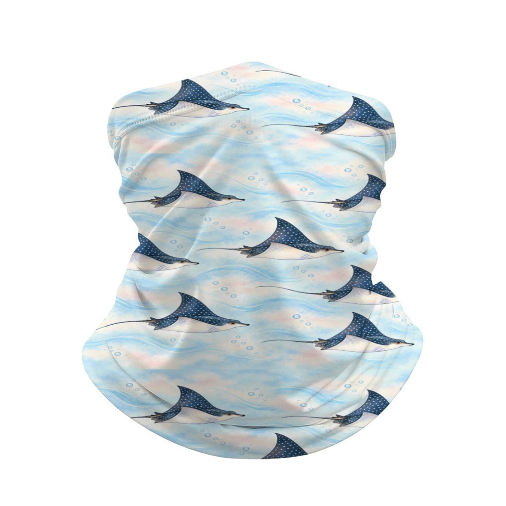 Neck gaiter and diving headband with navy spotted eagle rays on a pale blue and pink background