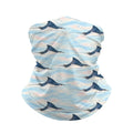 Neck gaiter and diving headband with navy spotted eagle rays on a pale blue and pink background