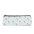 Slim zip pencil case printed with pelicans flying over soft blue waves on cream