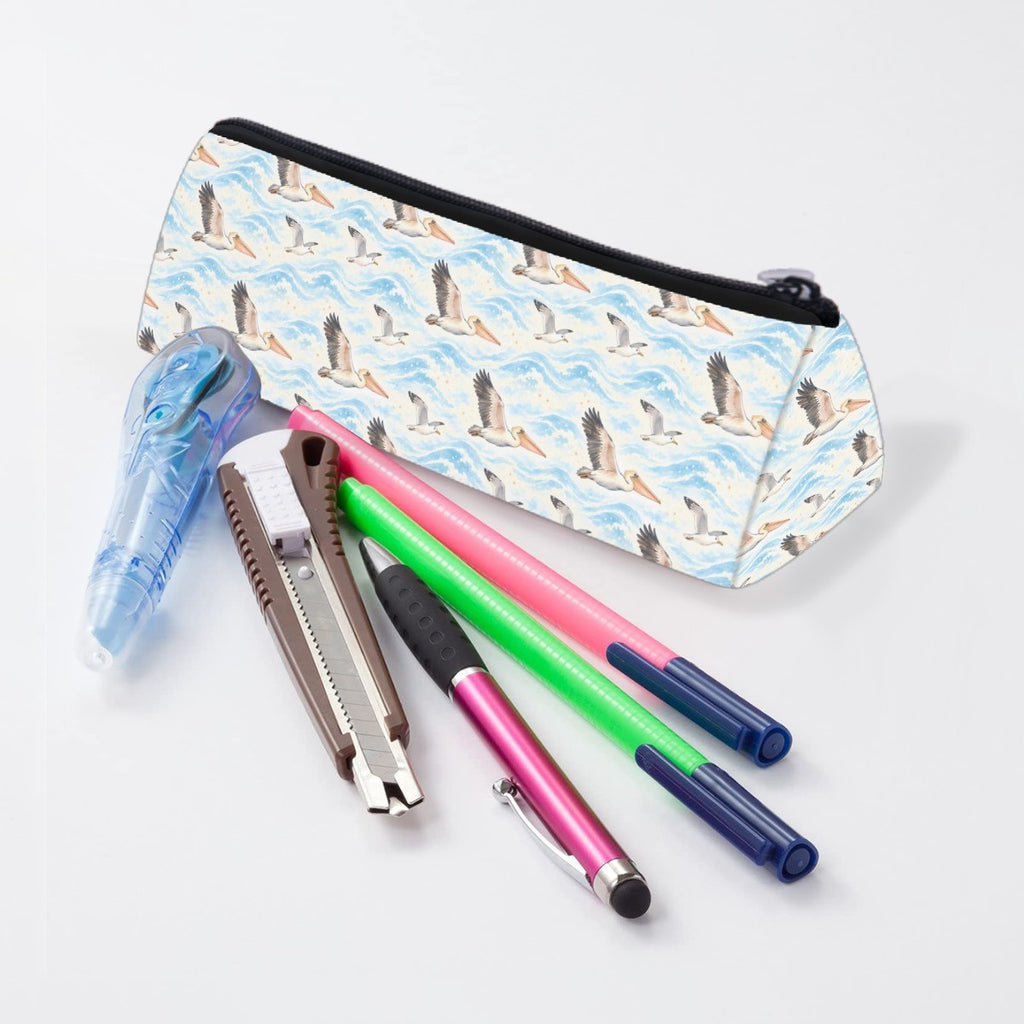 Pelican pencil case lying beside pens and markers