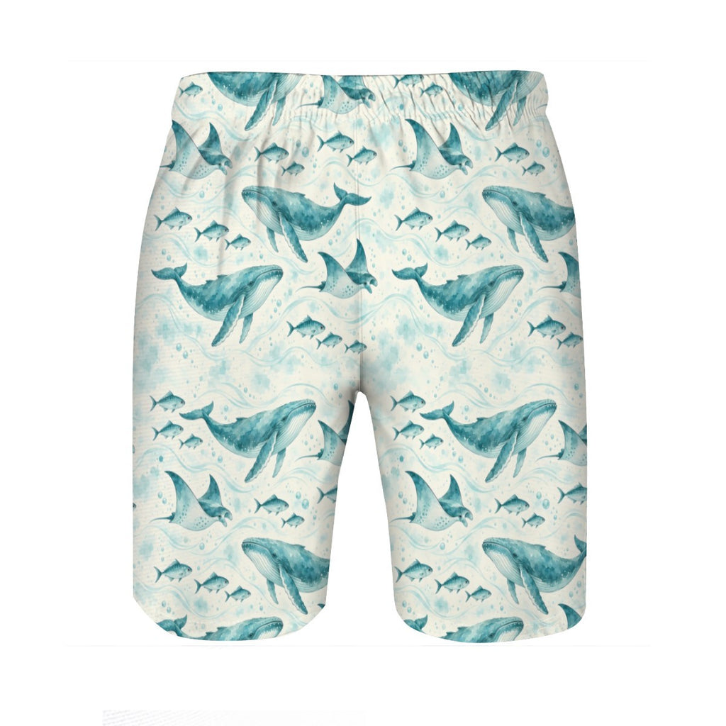 Whale and ray print swim trunks laid flat, second view showing the all-over teal watercolour pattern on cream