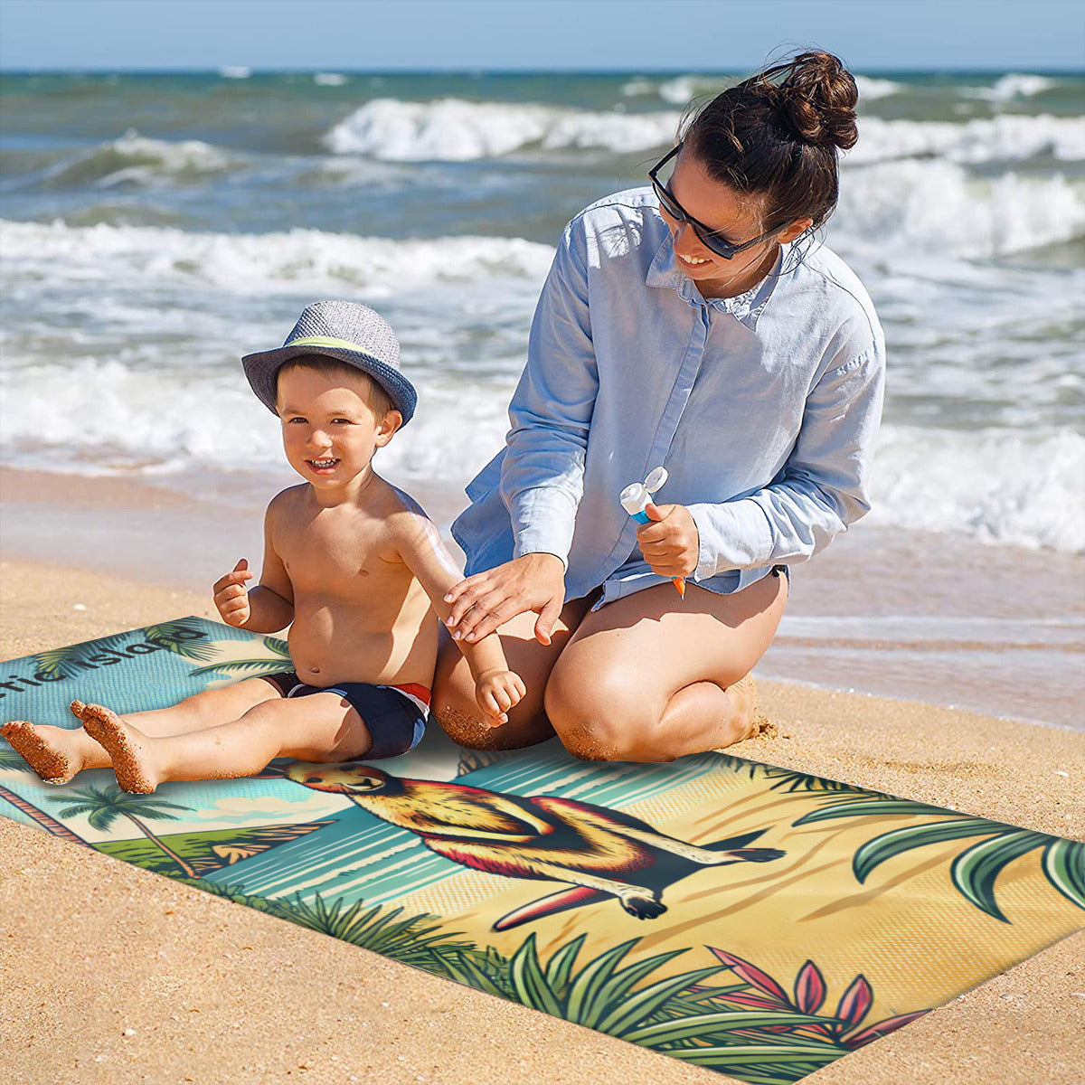 Family on the sand with the kangaroo beach towel laid out