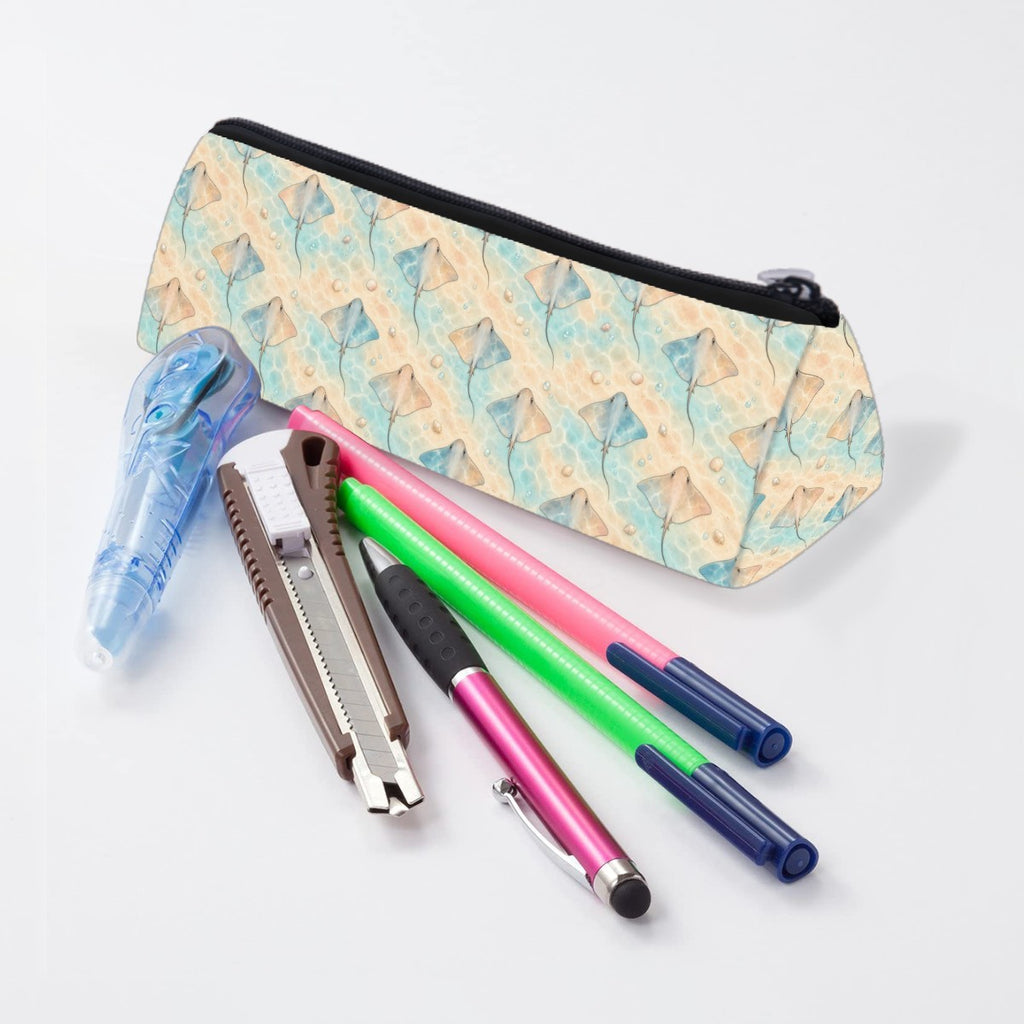 Stingray pencil case lying beside pens and markers