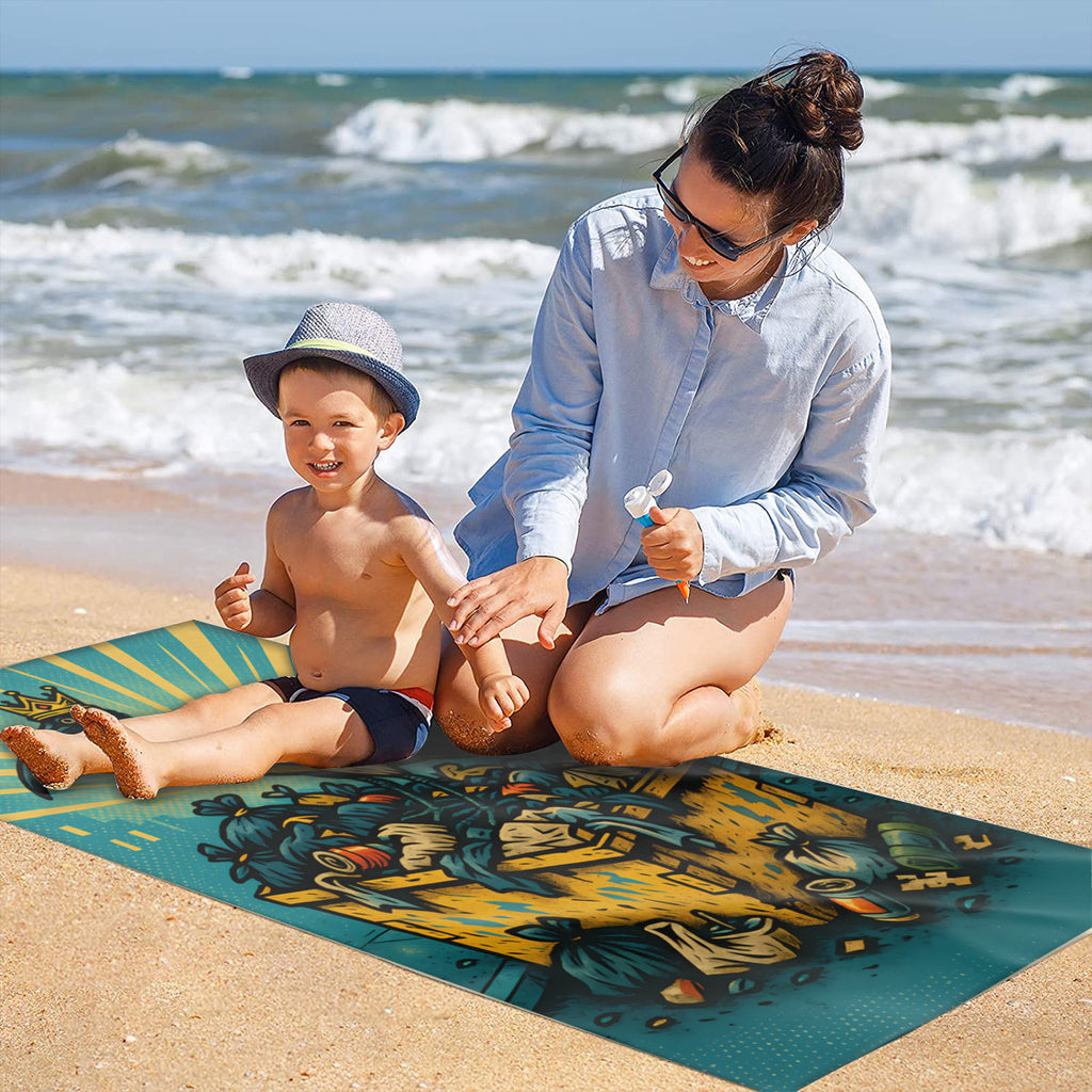 Family on the sand with the crowned ibis beach towel laid out