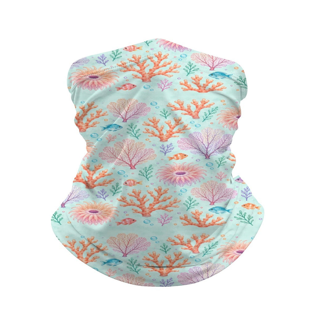 Neck gaiter and diving headband with pink and orange coral fans and small fish on an aqua background