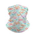 Neck gaiter and diving headband with pink and orange coral fans and small fish on an aqua background