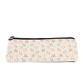 Slim zip pencil case printed with starfish, scallops and spiral shells in peach and sage on cream