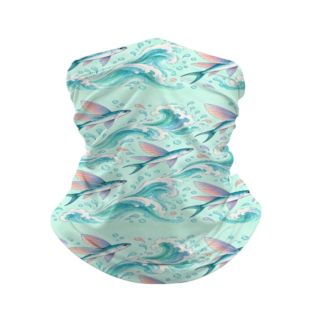Neck gaiter and diving headband with pink and coral flying fish above teal and white breaking waves on a mint background