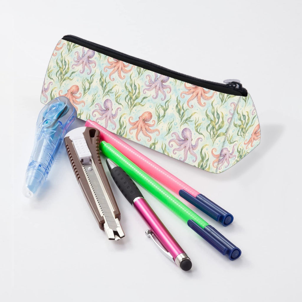 Octopus pencil case lying beside pens and markers