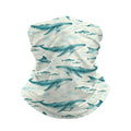 Neck gaiter and diving headband with teal whales and small fish on a pale cream background