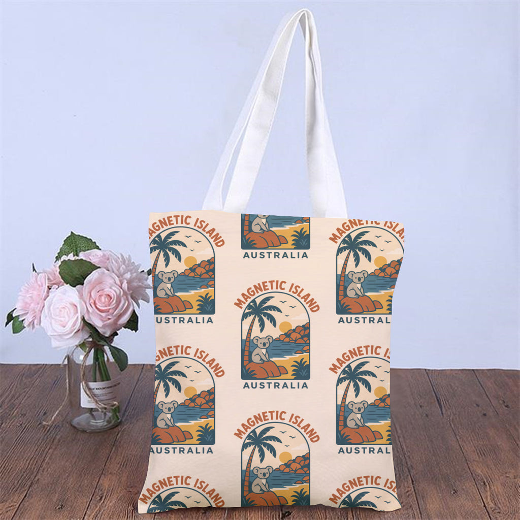 Retro Magnetic Island tote bag styled on a table with flowers