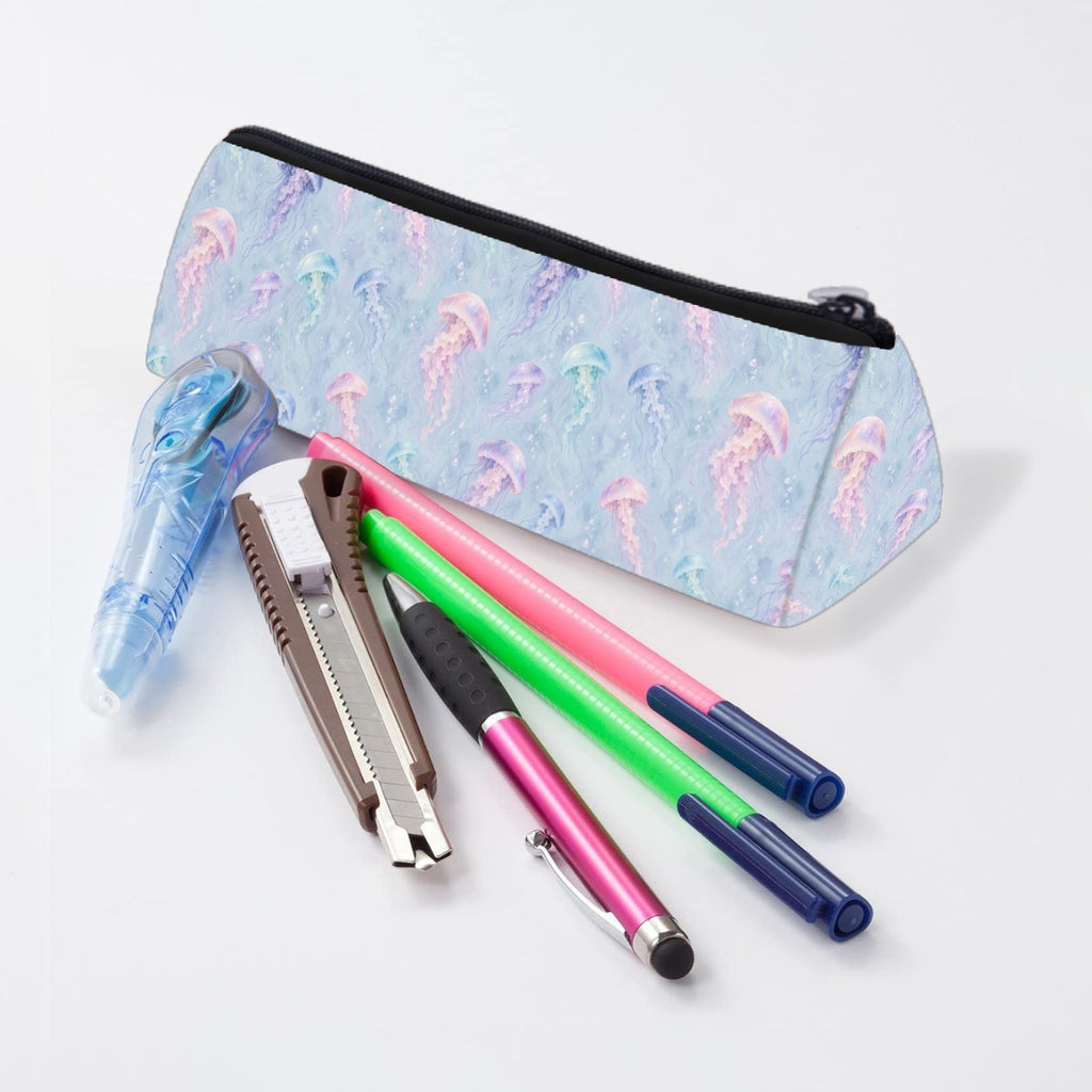 Jellyfish pencil case lying beside pens and markers