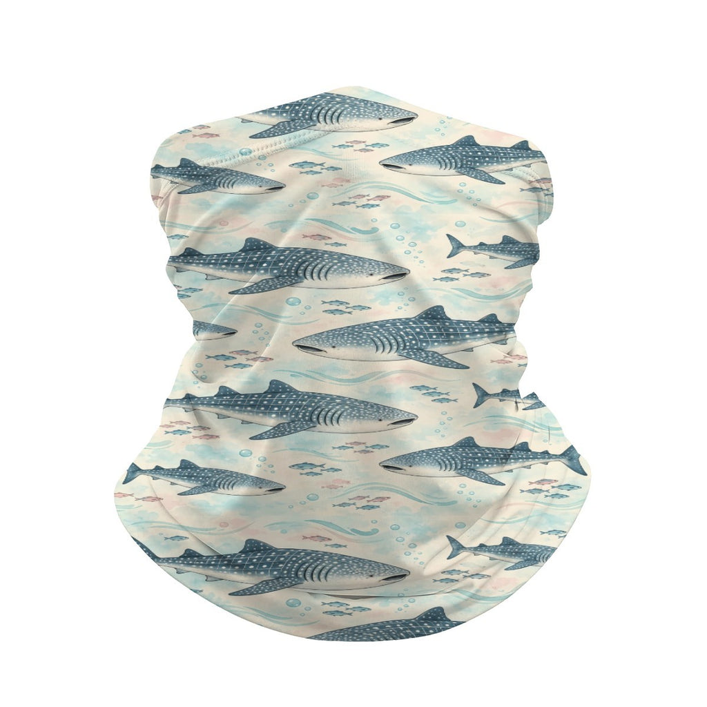 Neck gaiter and diving headband with teal and navy whale sharks and small fish on a cream background