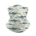 Neck gaiter and diving headband with teal and navy whale sharks and small fish on a cream background