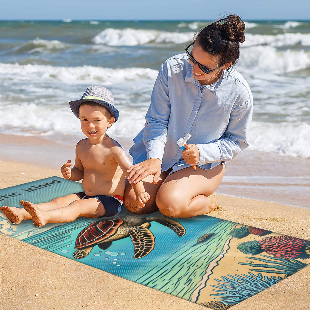 Family on the sand with the turtle beach towel laid out