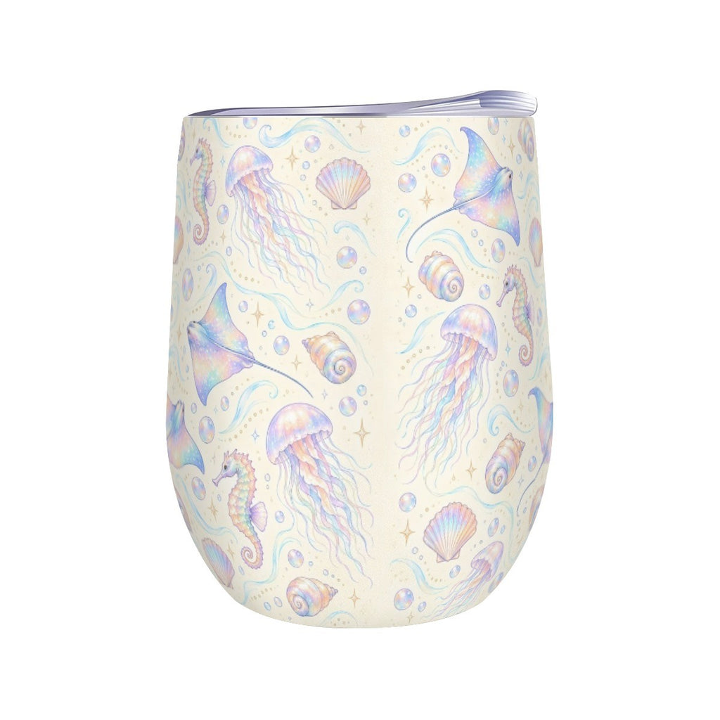 White stemless wine tumbler printed with a repeating pattern of jellyfish, seahorses and rays