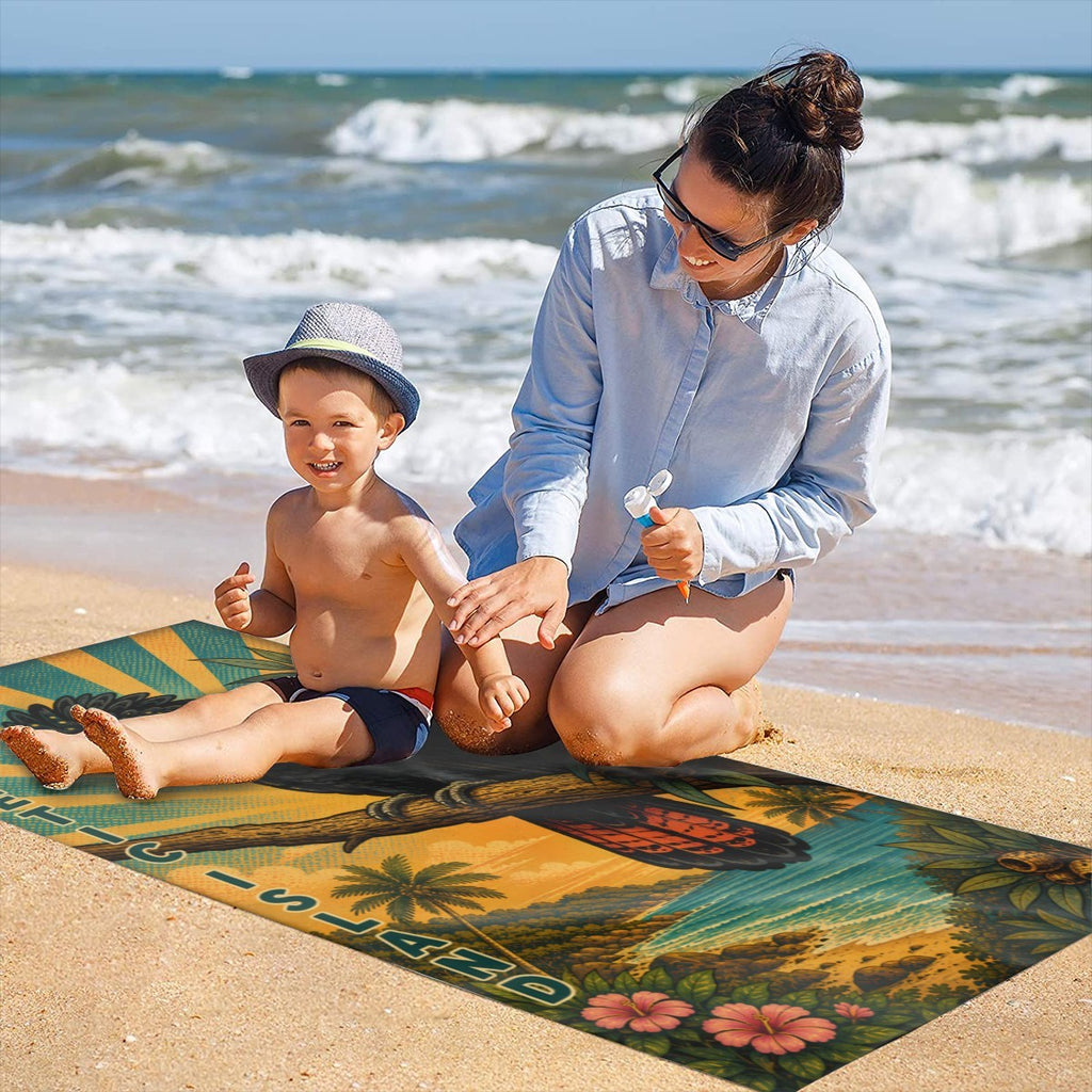 Family on the sand with the cockatoo beach towel laid out
