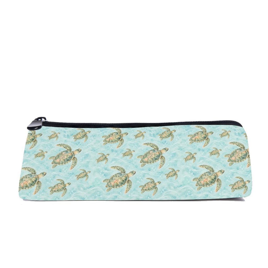 Slim zip pencil case printed with green and gold sea turtles on rippling turquoise water