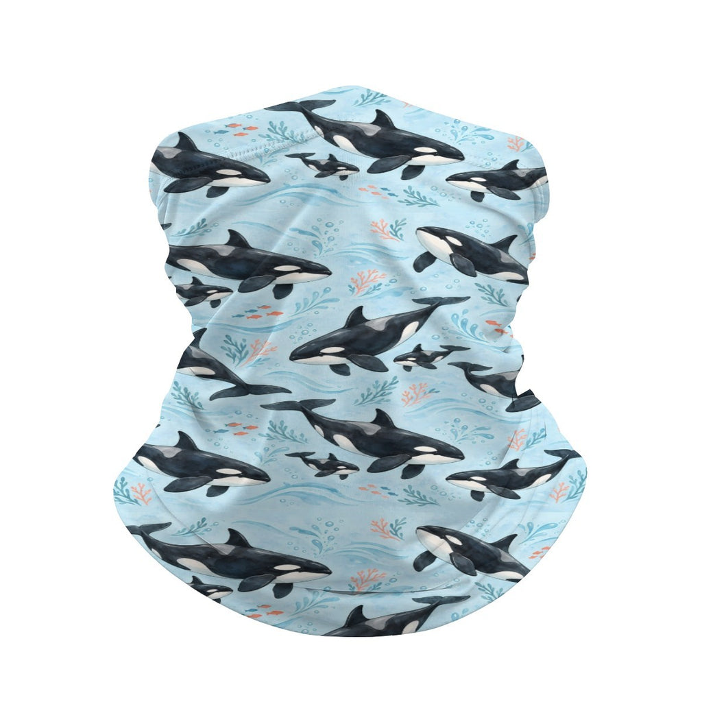 Neck gaiter and diving headband with black and white orcas on a light blue sea with pale foam
