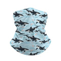 Neck gaiter and diving headband with black and white orcas on a light blue sea with pale foam