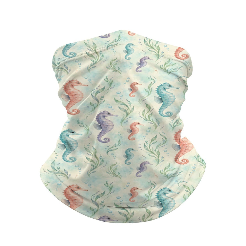 Neck gaiter and diving headband with coral, teal and purple seahorses and seaweed on a cream and pale green background