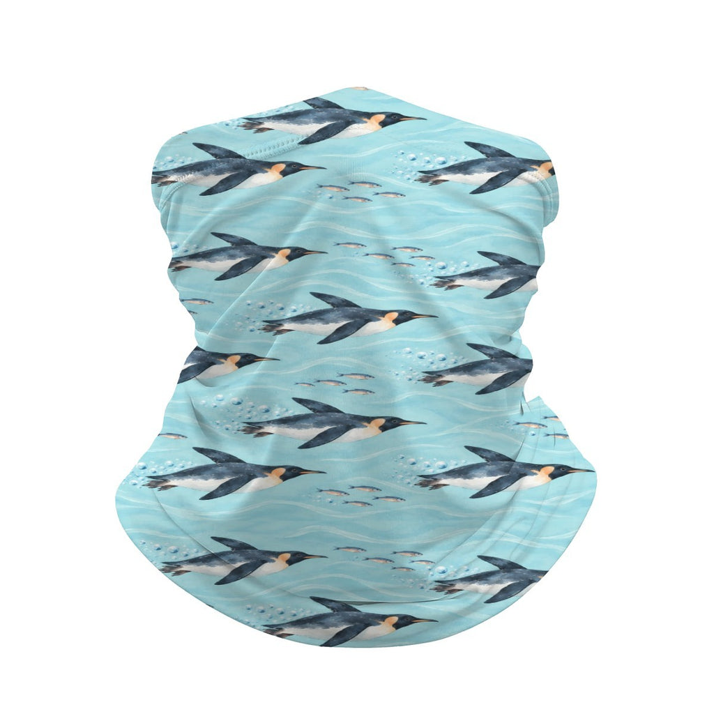 Neck gaiter and diving headband with navy penguins swimming on aqua and turquoise