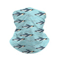 Neck gaiter and diving headband with navy penguins swimming on aqua and turquoise