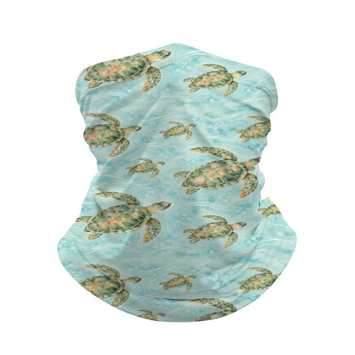Neck gaiter and diving headband with green sea turtles on aqua water with white wave lines