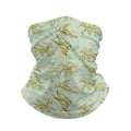 Neck gaiter and diving headband with olive and gold leafy sea dragons on a pale green background