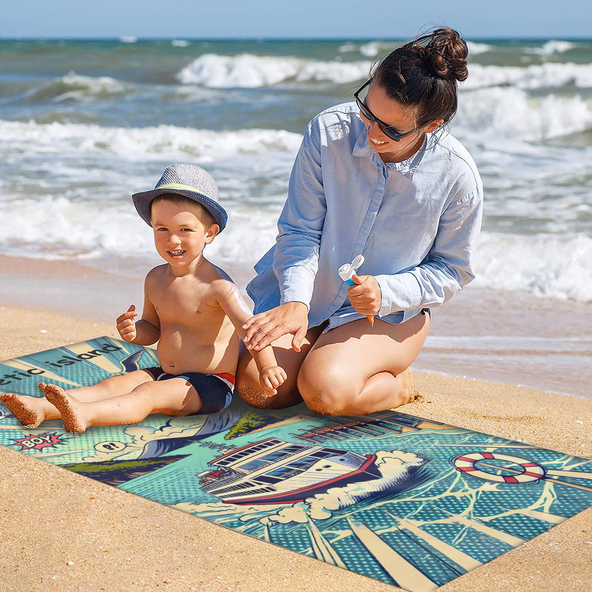 Family on the sand with the Magnetic Island ferry beach towel laid out