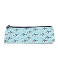 Slim zip pencil case printed with penguins swimming through clear aqua water