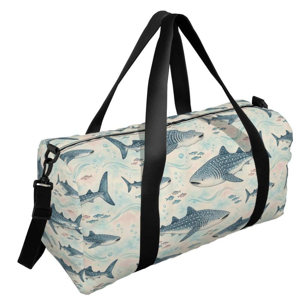 Blue-grey whale shark pattern duffle bag with two black handles and a shoulder strap, three-quarter view