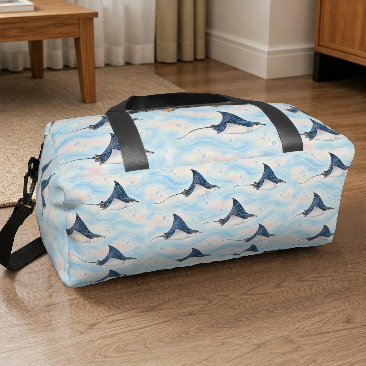 Spotted eagle ray duffle bag sitting on a wooden floor beside a table
